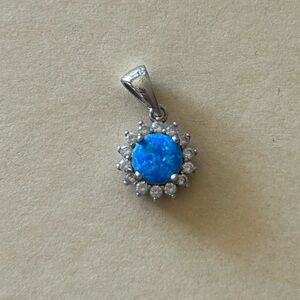 Sterling silver sun with blue stone pendant